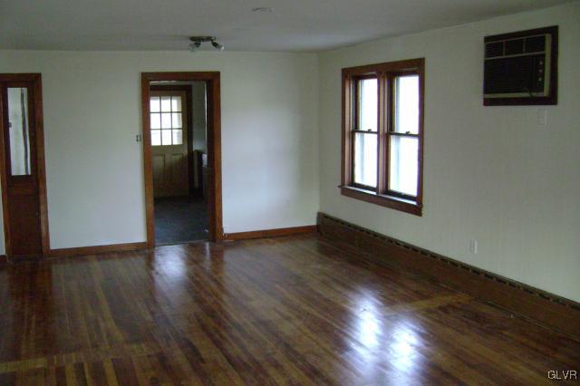 Kunkletown Road Kunkletown, PA 18058 - Photo 5 of 14 a view of an empty room with wooden floor and a window