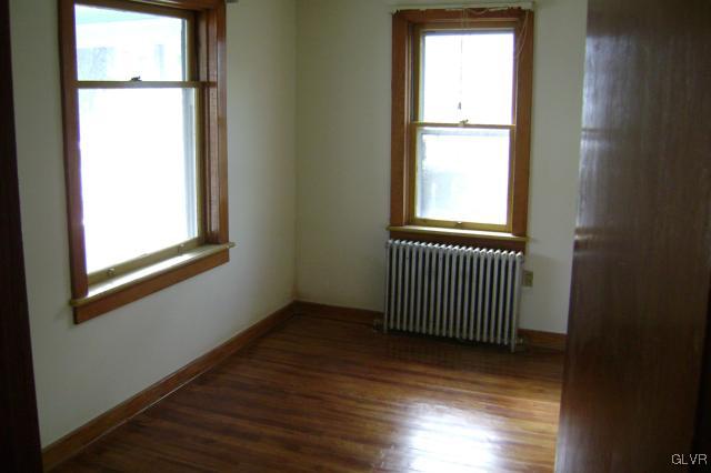 Kunkletown Road Kunkletown, PA 18058 - Photo 7 of 14 an empty room with wooden floor and a window