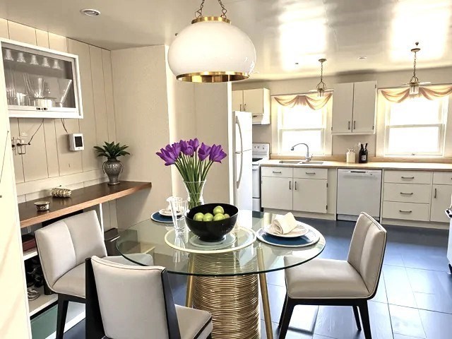 a kitchen with a table and chairs in it