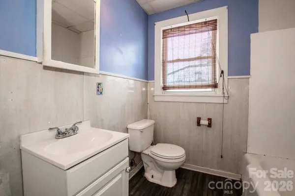 a bathroom with a sink a toilet and bathtub
