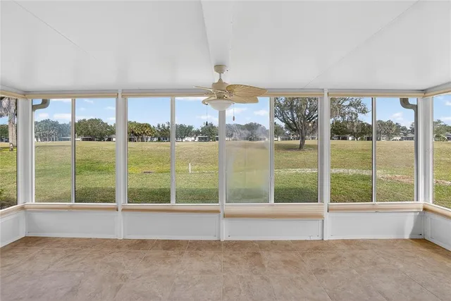 a view of an empty room with a balcony
