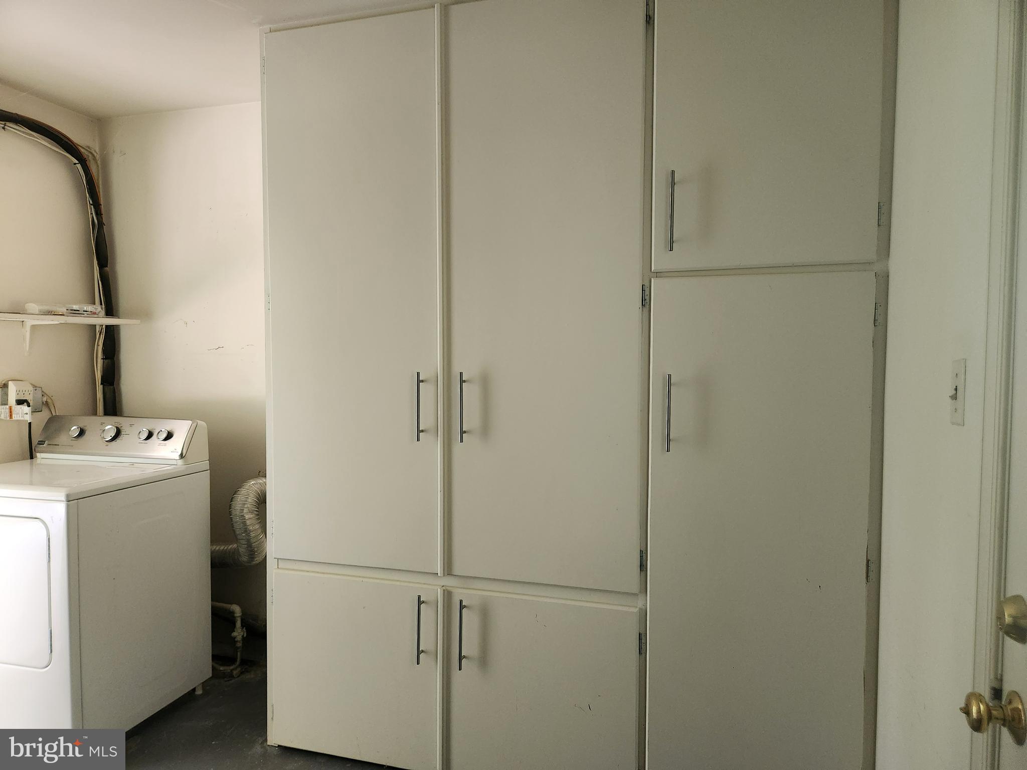 7510 Hogarth Street Springfield, VA 22151 - Photo 35 of 47 Laundry room..lots of shelves