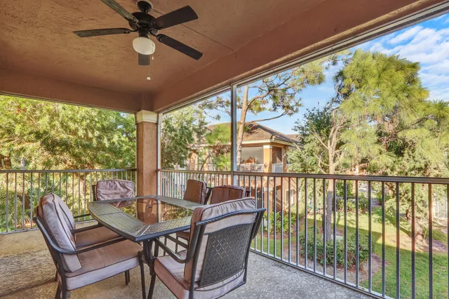 a view of a balcony with furniture