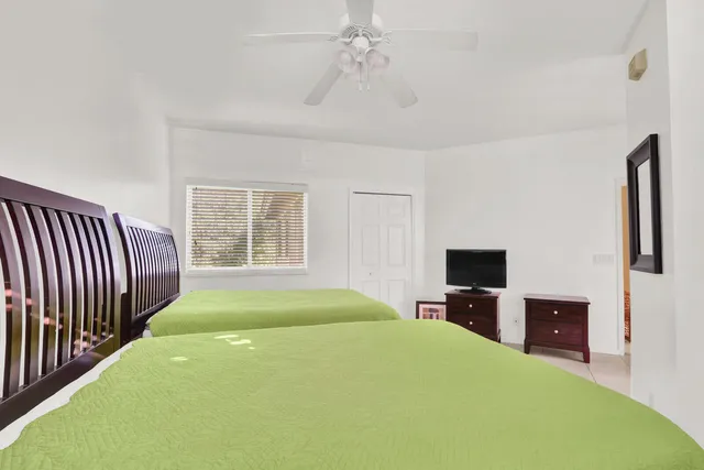 a bed room with a bed and a television