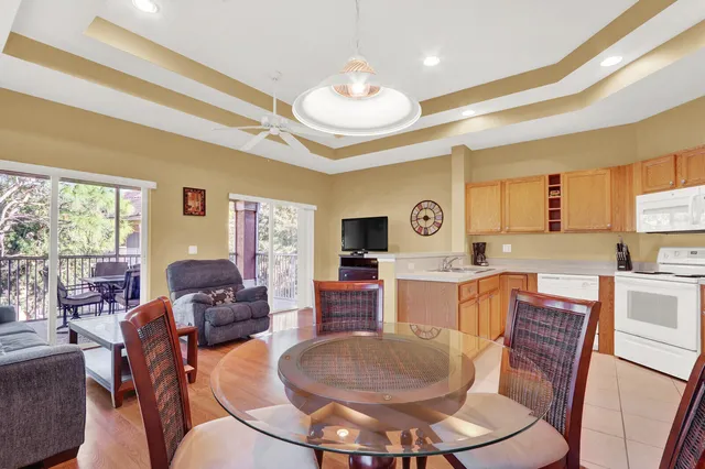 a living room with fireplace furniture and a wooden floor
