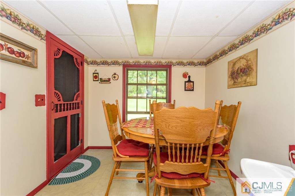 35 Warrington Road Columbia, NJ 07832 - Photo 11 of 31 a view of a dining room with furniture window and wooden floor