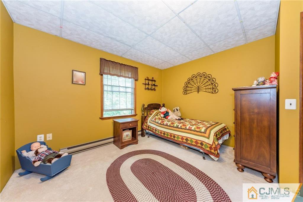 35 Warrington Road Columbia, NJ 07832 - Photo 14 of 31 a bedroom with a bed and a window