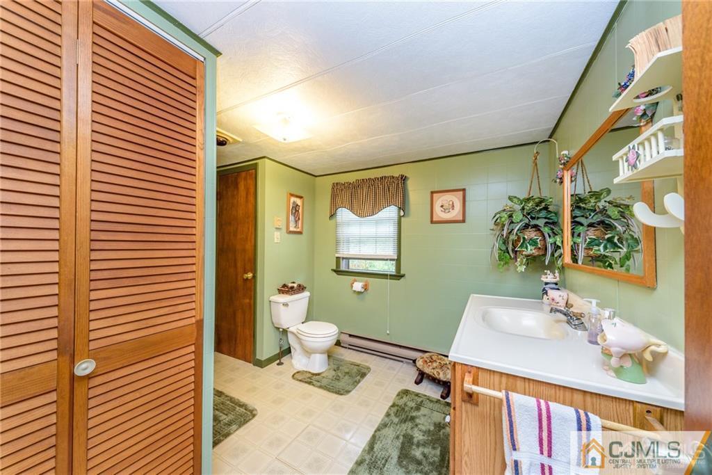 35 Warrington Road Columbia, NJ 07832 - Photo 18 of 31 a bathroom with a sink and a mirror