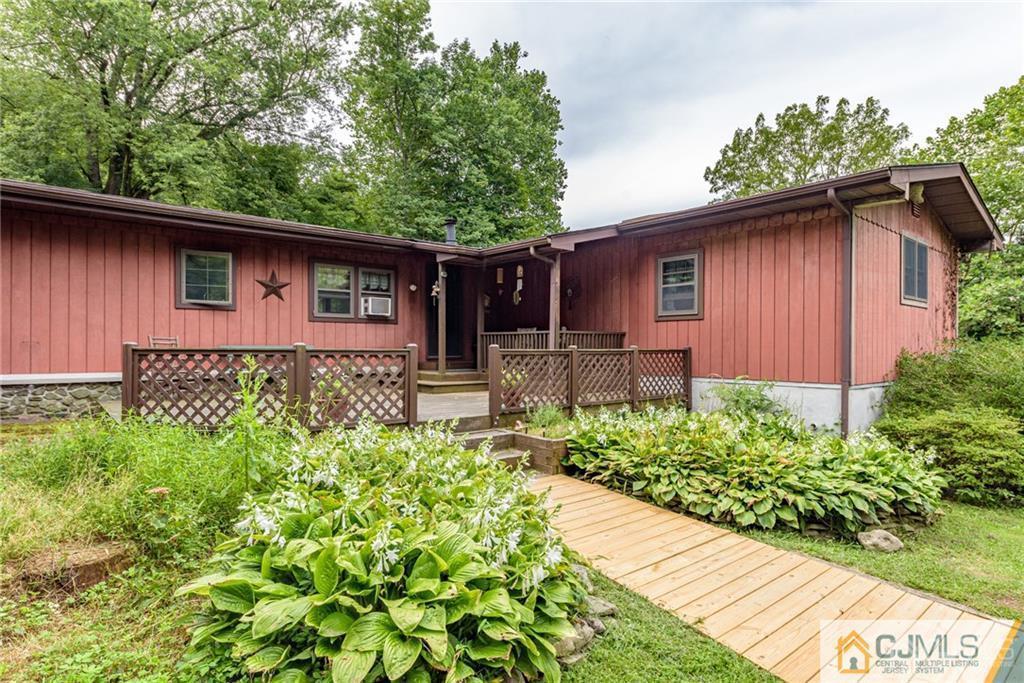 35 Warrington Road Columbia, NJ 07832 - Photo 2 of 31 a backyard of a house with table and chairs