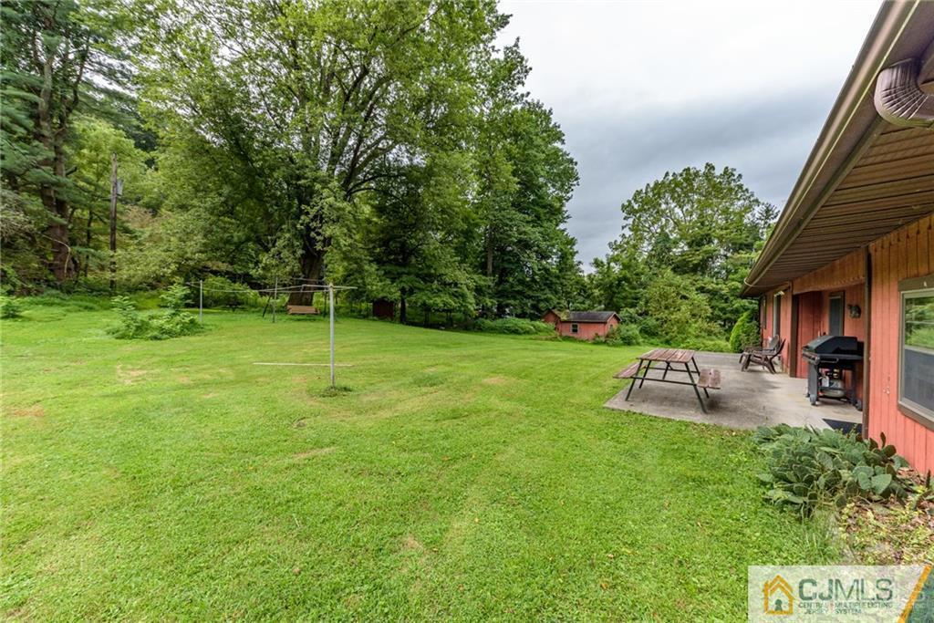 35 Warrington Road Columbia, NJ 07832 - Photo 30 of 31 a view of a backyard with sitting area