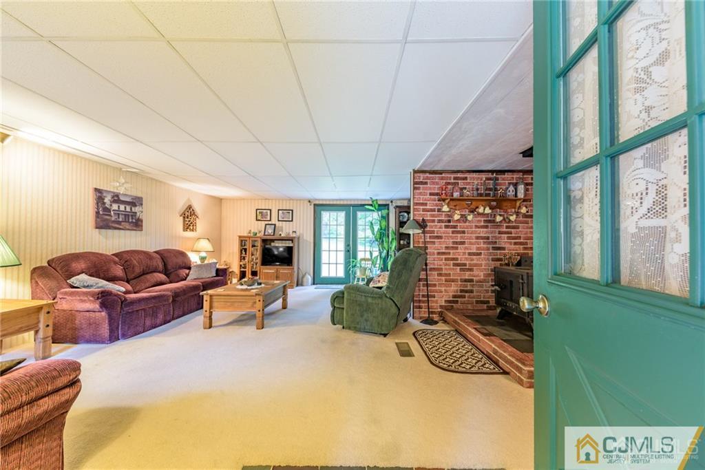 35 Warrington Road Columbia, NJ 07832 - Photo 4 of 31 a living room with furniture a rug and a large window