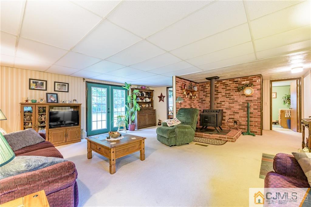 35 Warrington Road Columbia, NJ 07832 - Photo 5 of 31 a living room with furniture large window and flat screen tv
