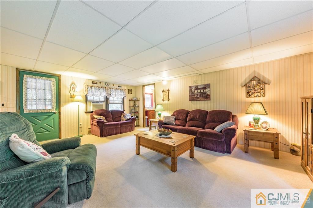 35 Warrington Road Columbia, NJ 07832 - Photo 6 of 31 a living room with furniture and a large window