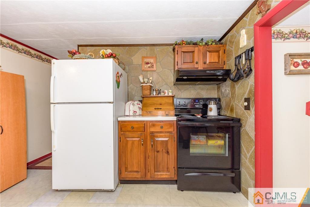35 Warrington Road Columbia, NJ 07832 - Photo 9 of 31 a kitchen with a refrigerator and a stove