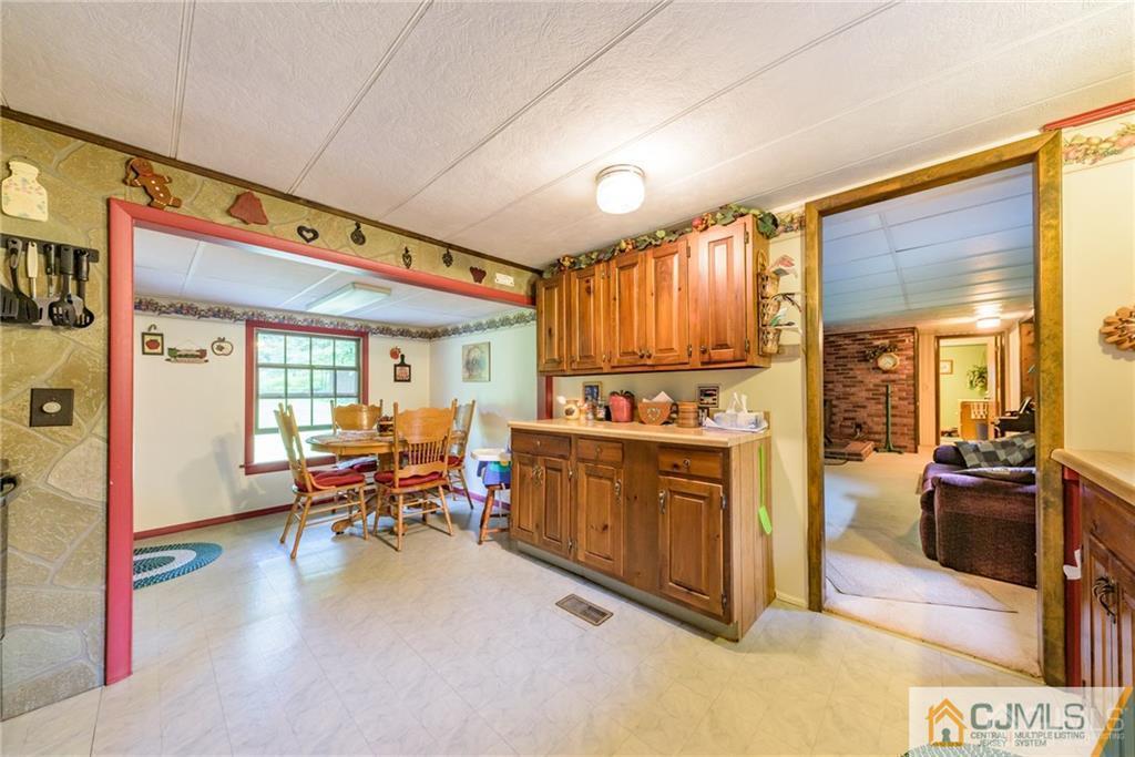 35 Warrington Road Columbia, NJ 07832 - Photo 10 of 31 a view of a kitchen with kitchen island wooden floors and stainless steel appliances