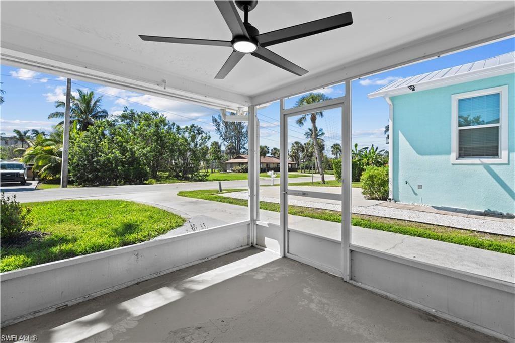 1855 Danford Street, Unit A Naples, FL 34112 - Photo 18 of 22 Unfurnished sunroom with ceiling fan