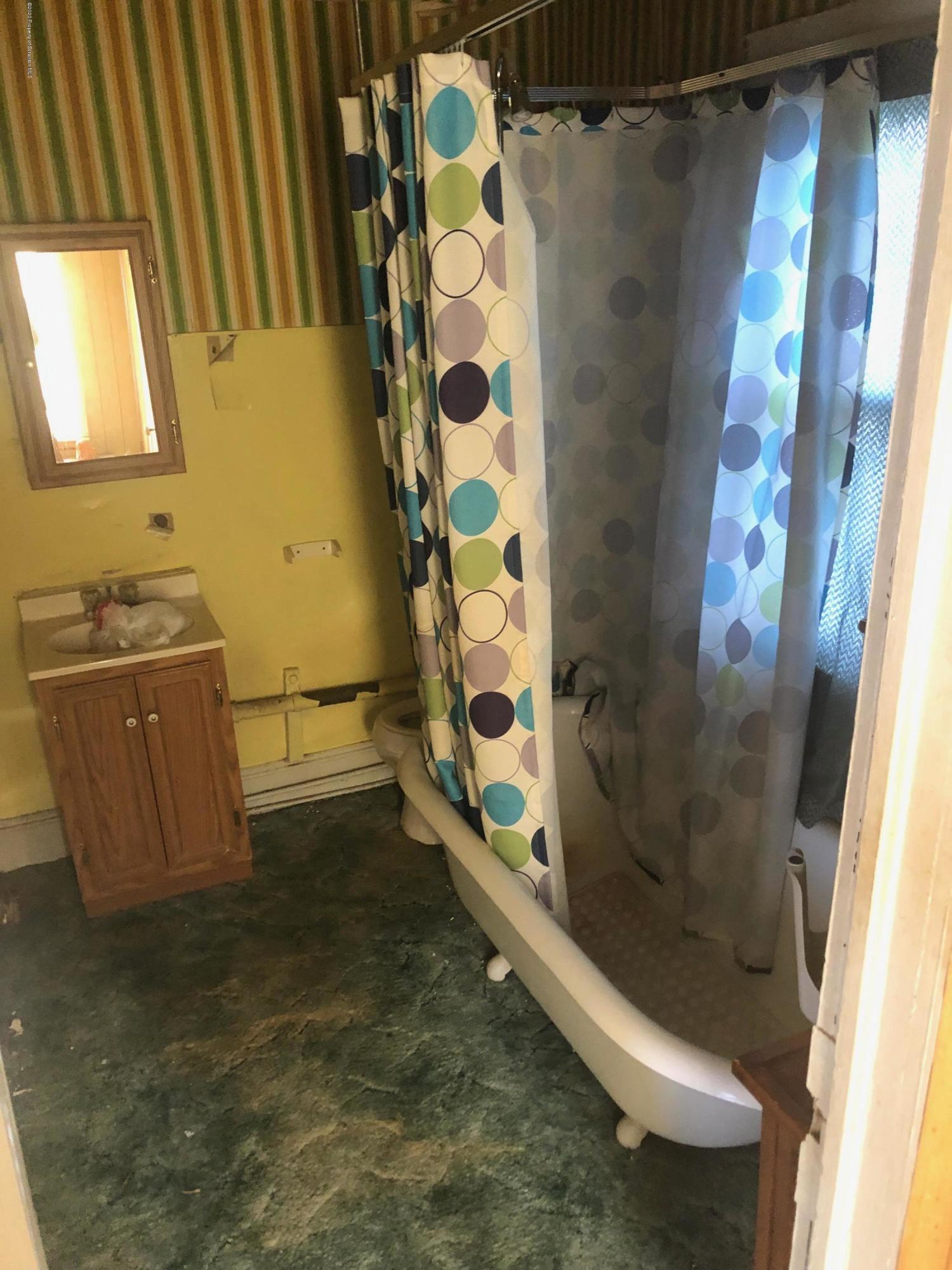 1902 Lafayette Street Scranton, PA 18504 - Photo 8 of 12 a bathroom with a bathtub and shower