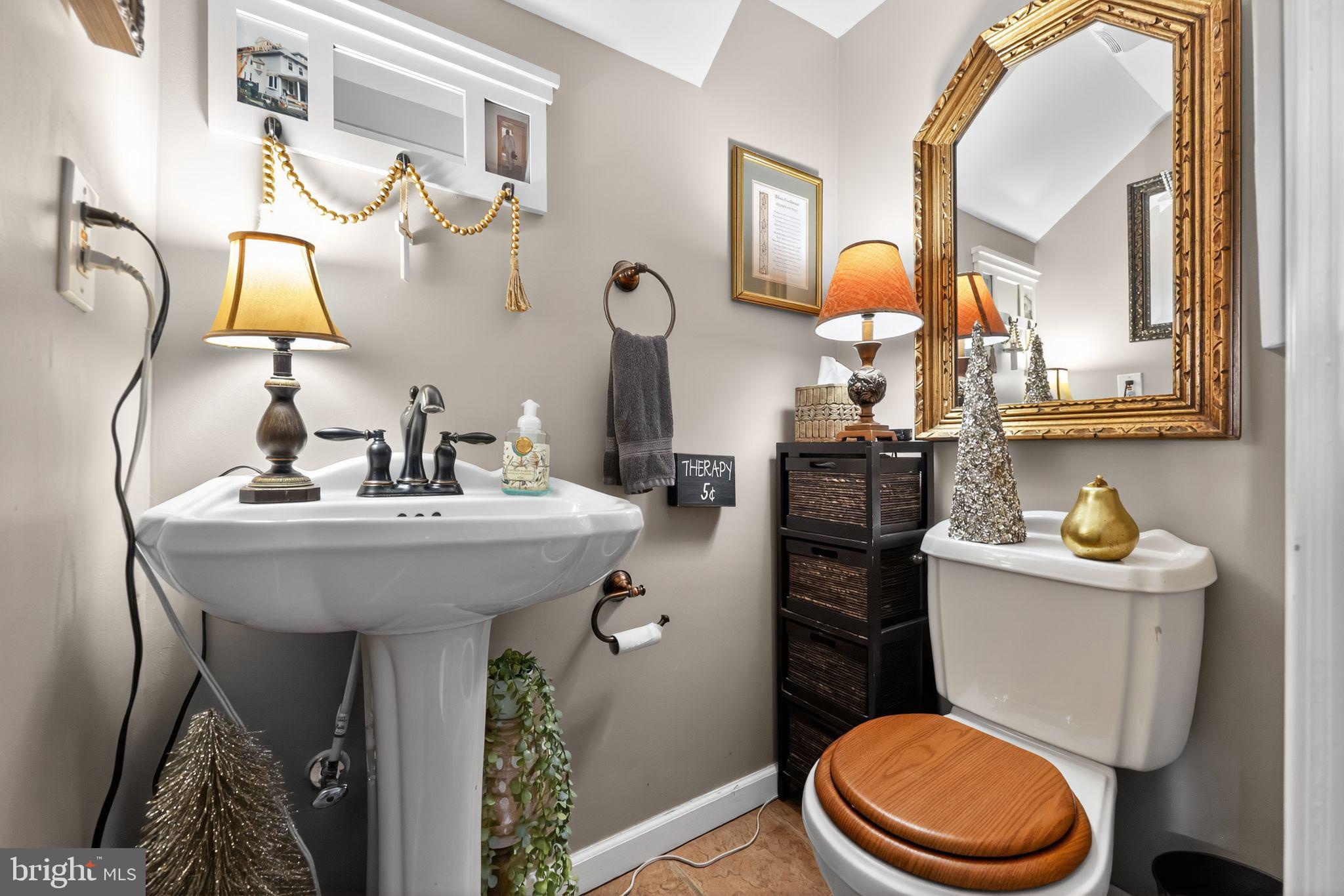 514 Park Avenue Laurel Springs, NJ 08021 - Photo 12 of 30 a bathroom with a sink a toilet and mirror