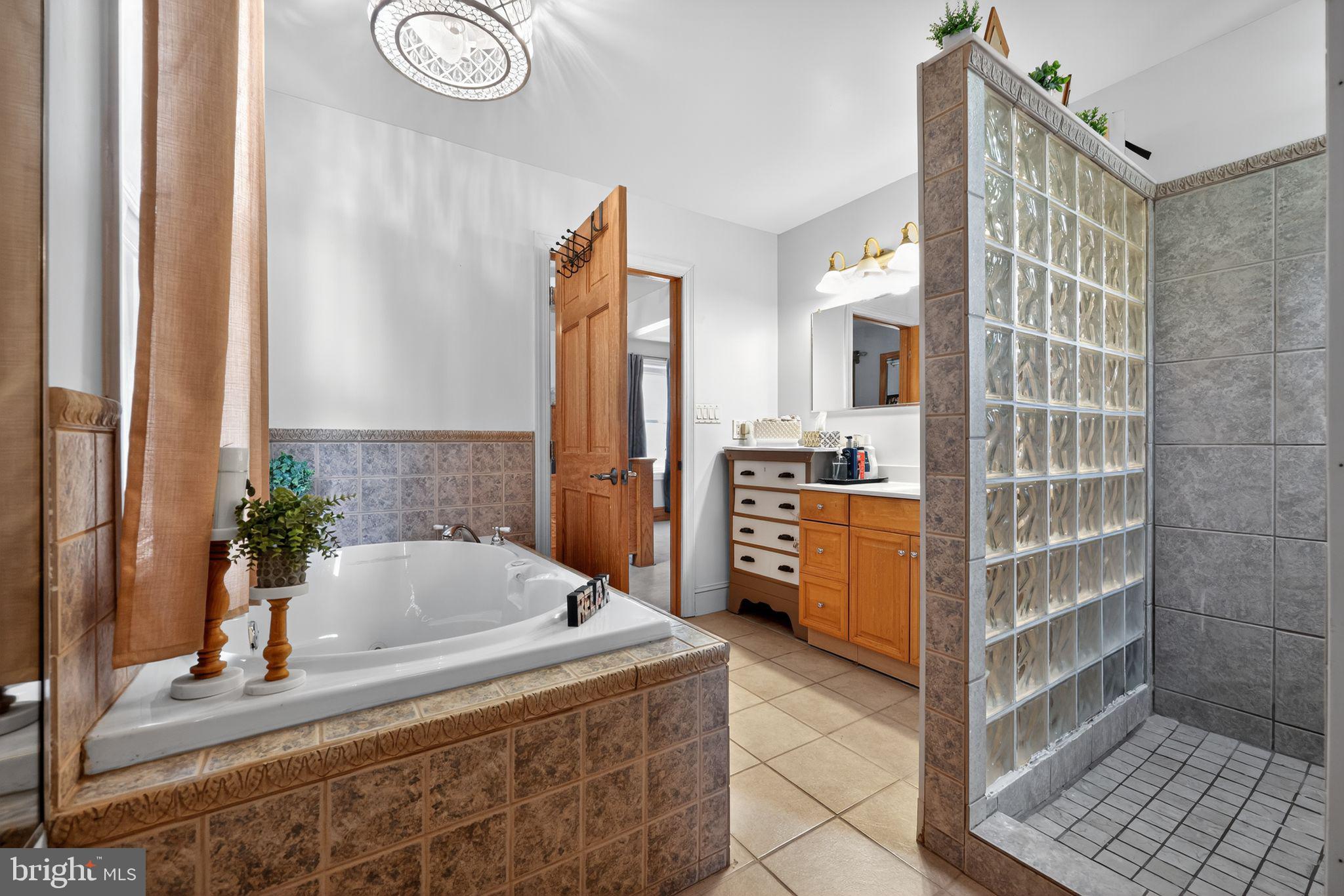 514 Park Avenue Laurel Springs, NJ 08021 - Photo 15 of 30 a bathroom with a tub sink and mirror