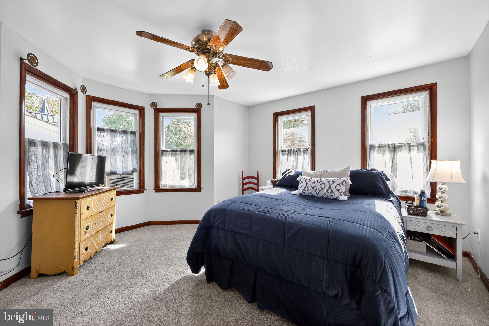 514 Park Avenue Laurel Springs, NJ 08021 - Photo 18 of 30 a bedroom with a bed a dresser next to a window