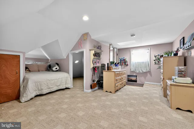 a bedroom with furniture and a bed