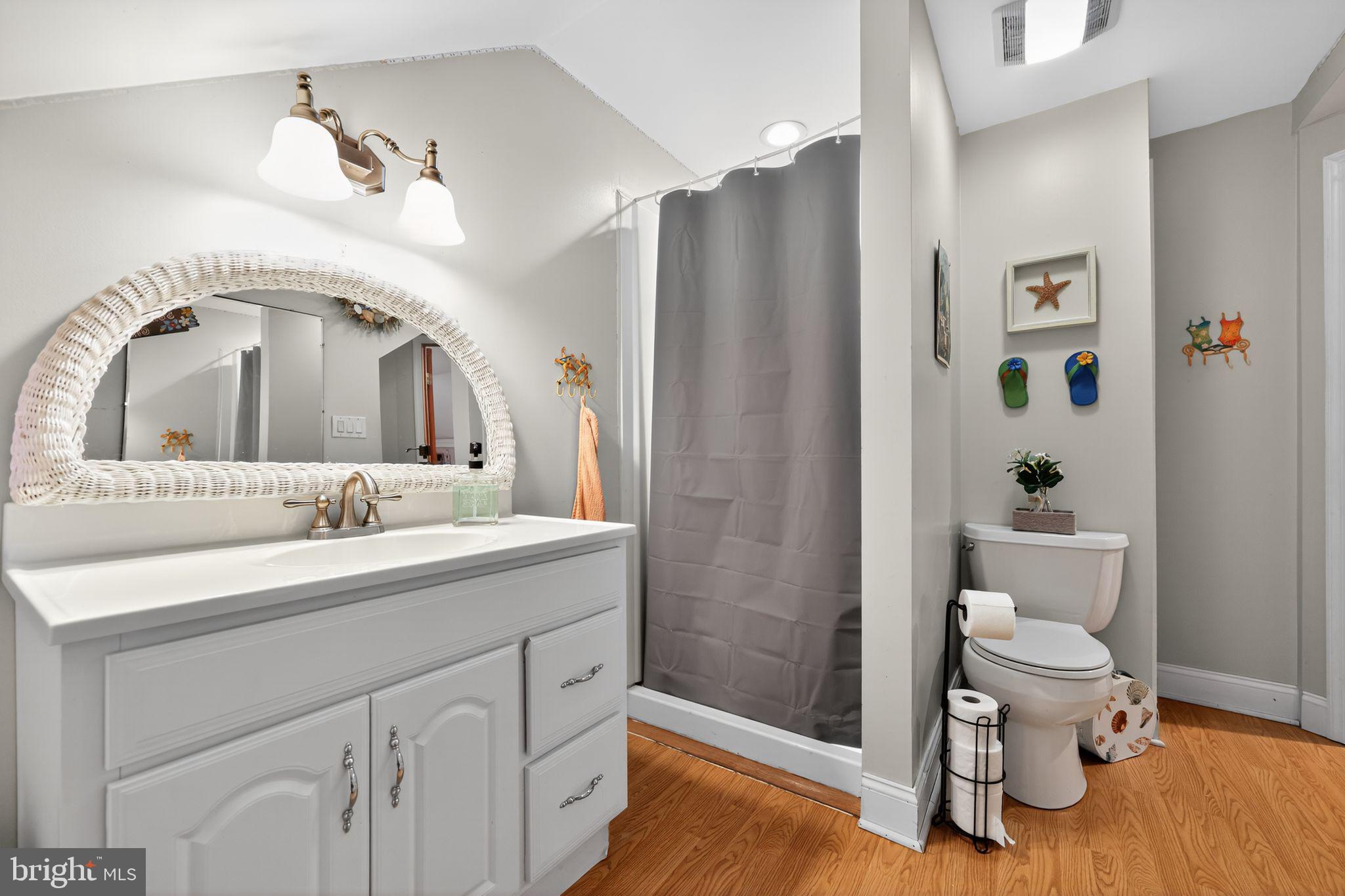 514 Park Avenue Laurel Springs, NJ 08021 - Photo 22 of 30 a bathroom with a sink a toilet and shower