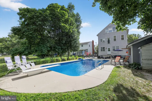 a view of a swimming pool with a patio