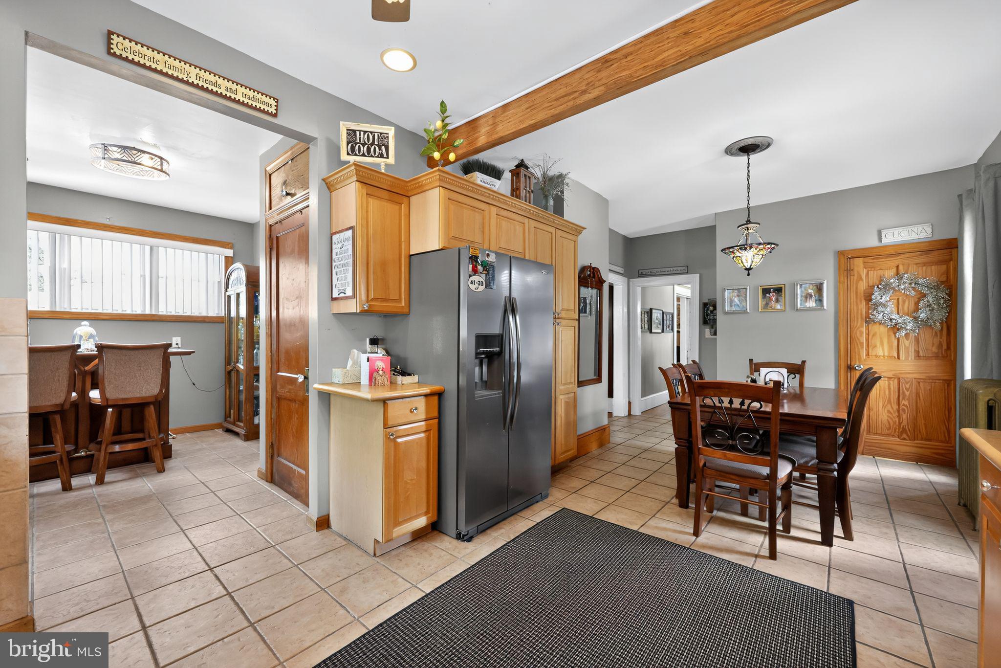514 Park Avenue Laurel Springs, NJ 08021 - Photo 10 of 30 a kitchen with stainless steel appliances kitchen island granite countertop a refrigerator and a dining table