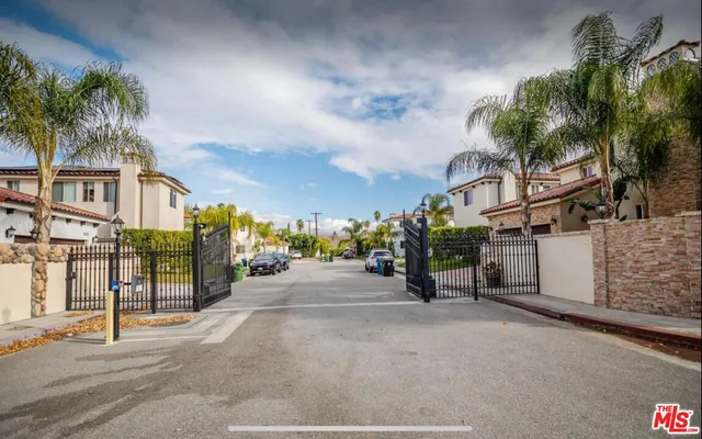 a view of a street with a building in the background