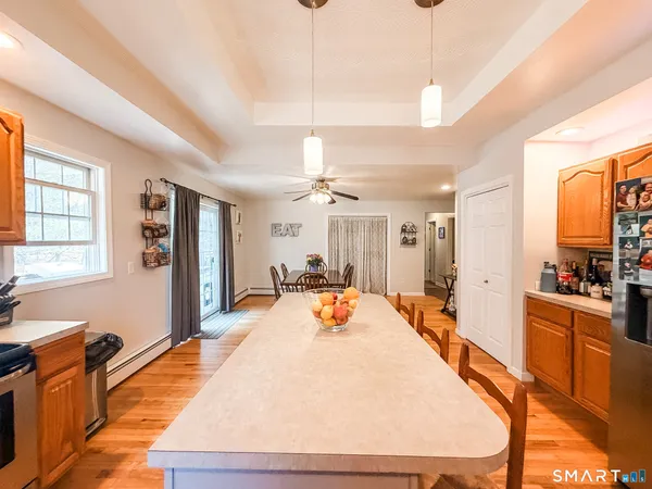 a large bathroom with a tub sink shower and mirror