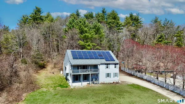 a living room with hard wood flooring