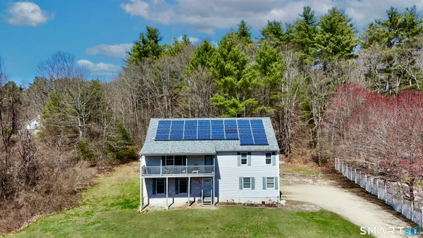 a large kitchen with a table and chairs in it