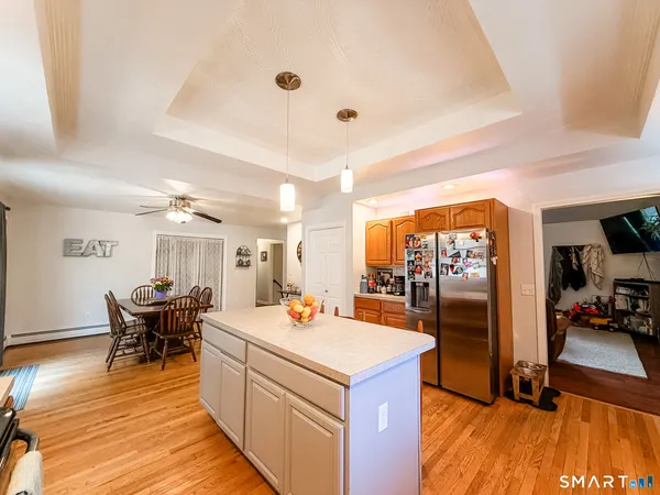 a spacious bathroom with a mirror a sink and a mirror