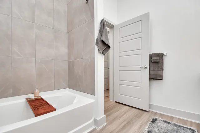 a bathroom with a bathtub and a shower