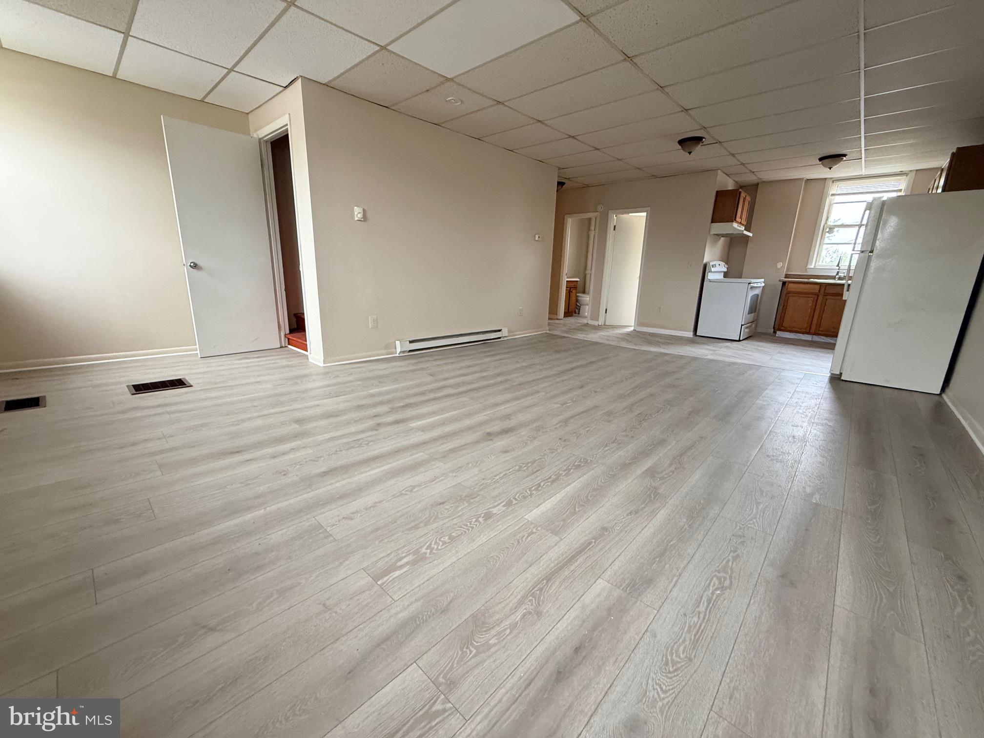 Spacious, light-filled living area.