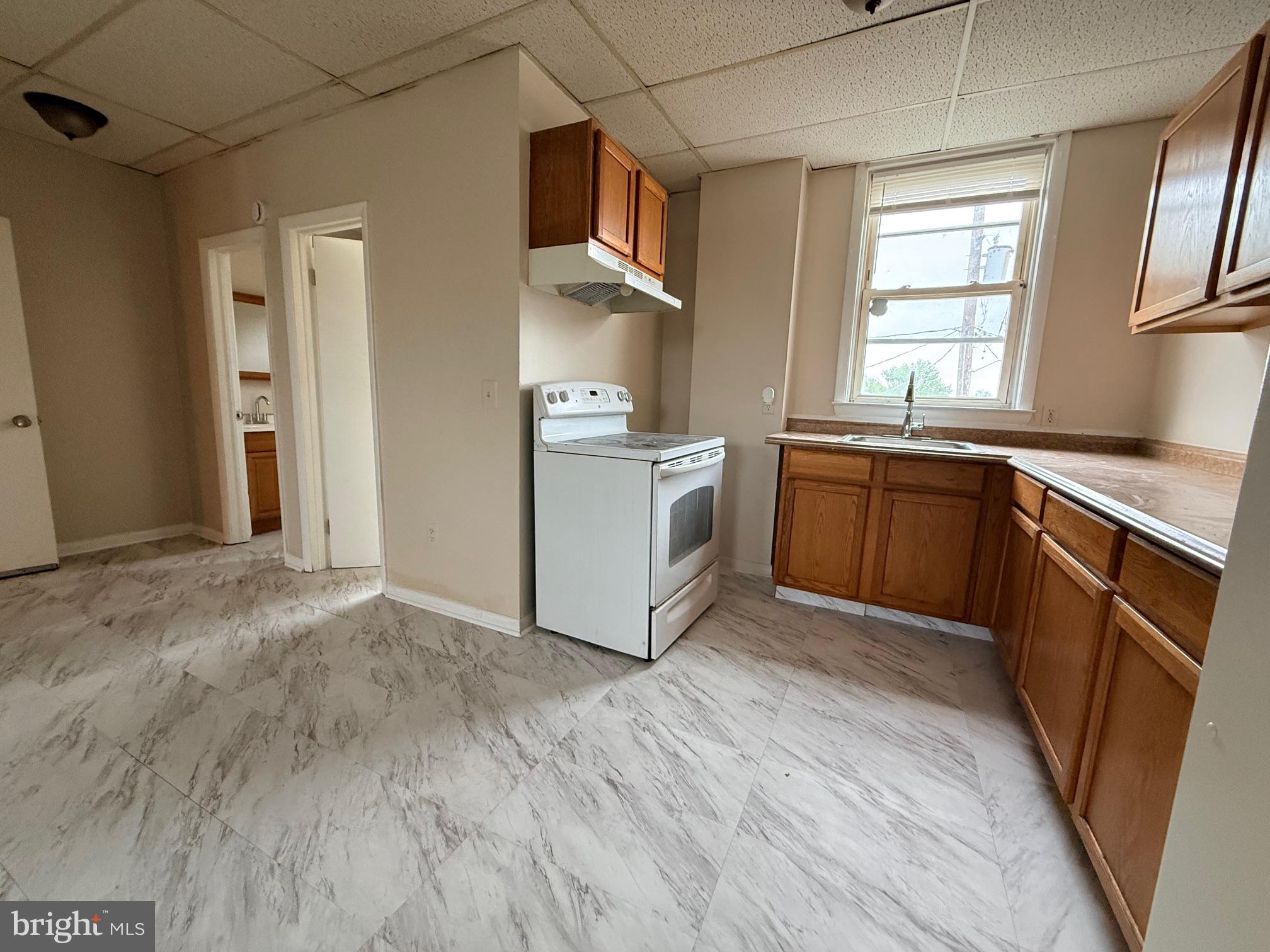 5307 York Road Baltimore, MD 21212 - Photo 5 of 21 a kitchen with stainless steel appliances granite countertop a stove a sink dishwasher and a refrigerator