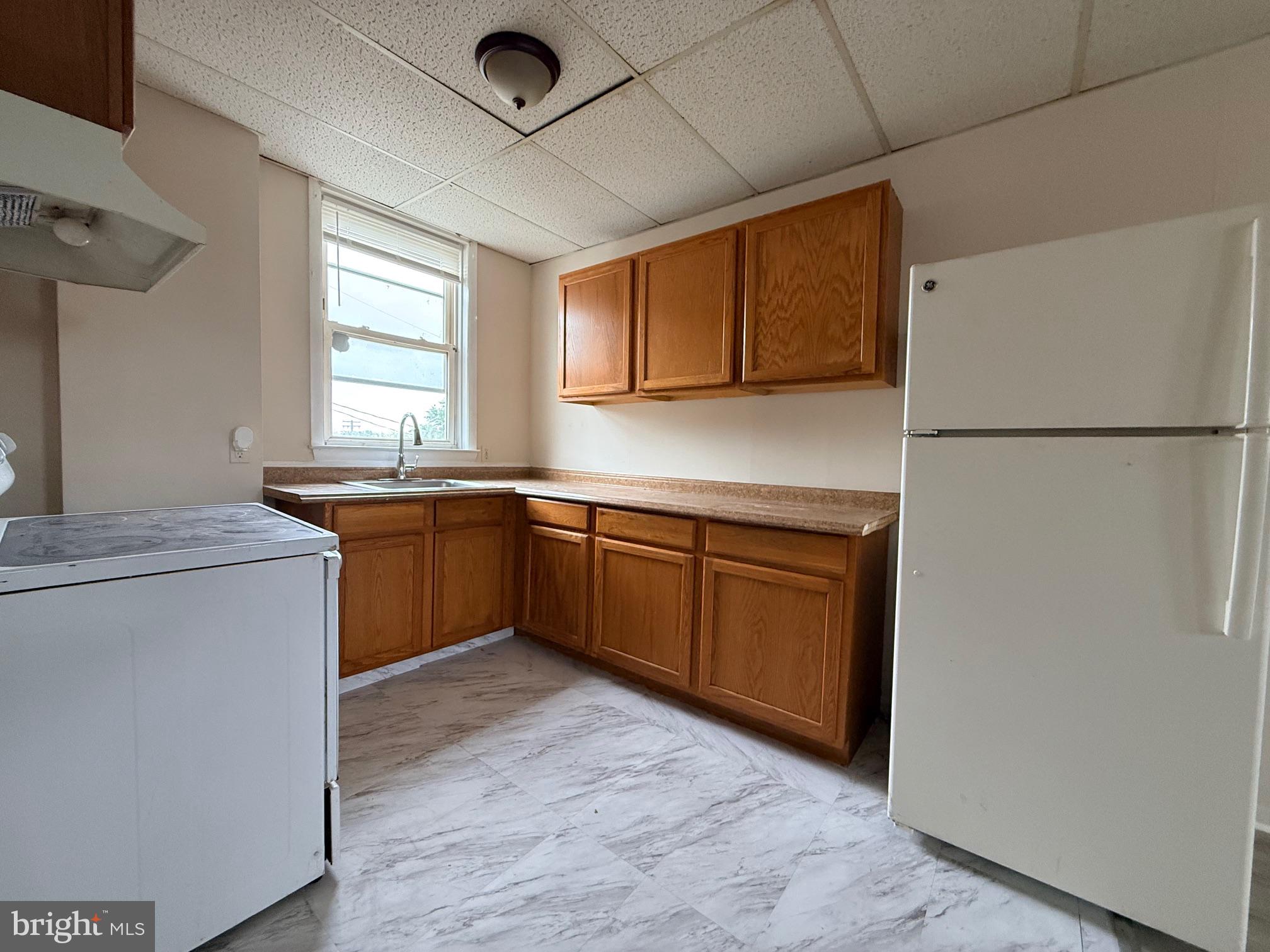 5307 York Road Baltimore, MD 21212 - Photo 6 of 21 a kitchen with stainless steel appliances granite countertop a sink stove and refrigerator