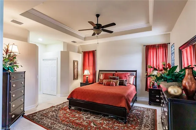 a bedroom with a bed dresser and a window