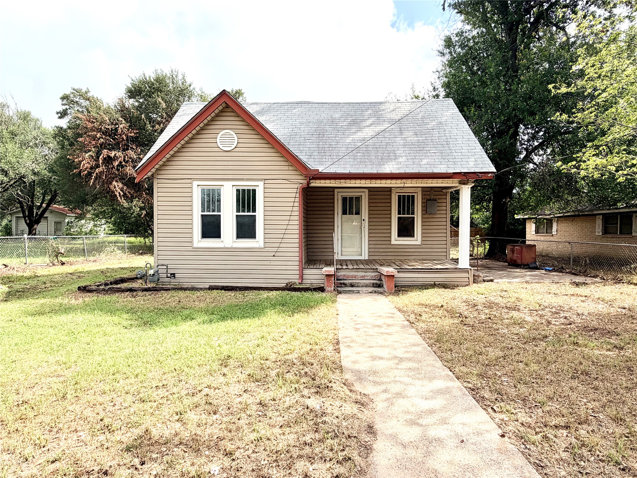 702 East 18th Street Cameron, TX 76520 - Photo 1 of 14 A charming single-story residence with a welcoming front porch awaits.