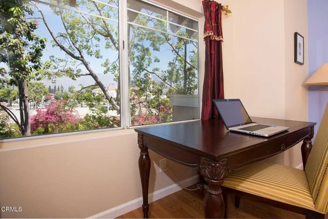 a view of a workspace with furniture