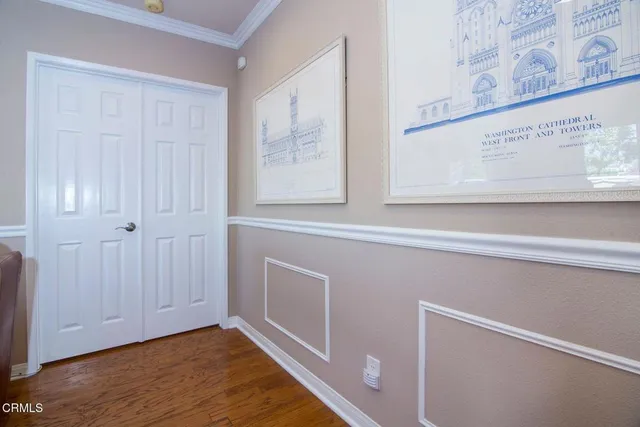 a view of an entryway with wooden floor
