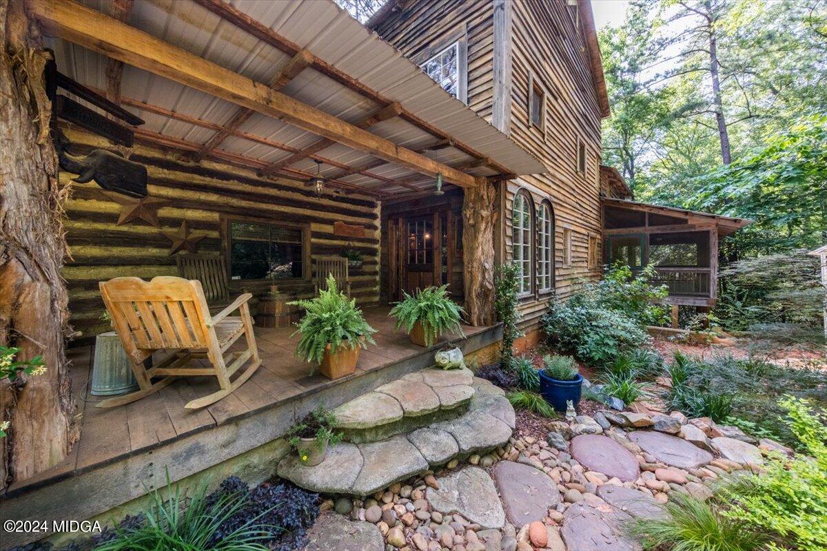 228 Pine Grove Church Road Culloden, GA 31016 - Photo 1 of 40 a view of porch with seating space