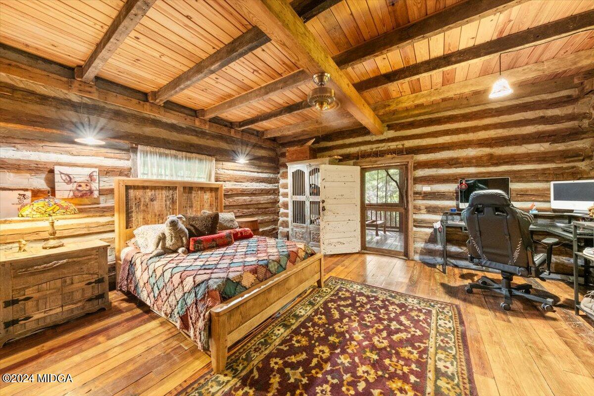 228 Pine Grove Church Road Culloden, GA 31016 - Photo 20 of 40 a bedroom with furniture and a large window