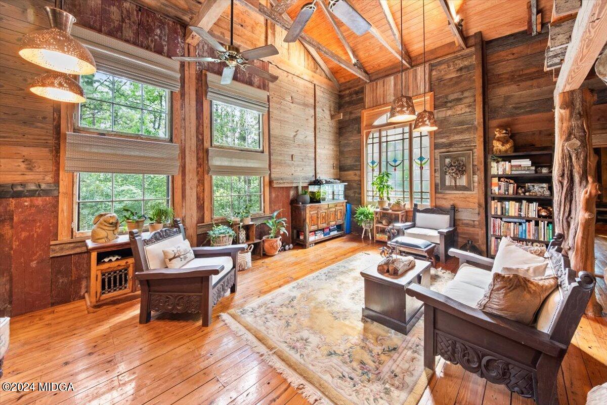 228 Pine Grove Church Road Culloden, GA 31016 - Photo 2 of 40 a living room filled with furniture hardwood floor and a table