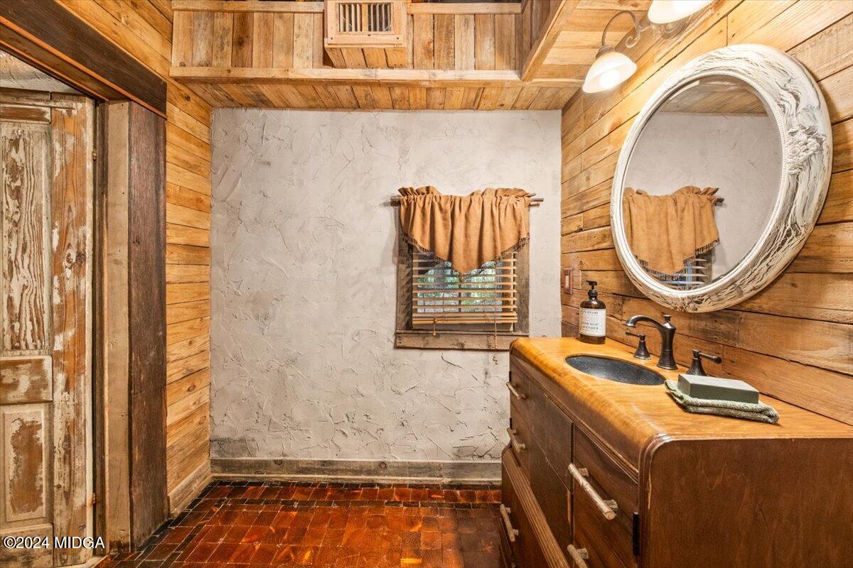 228 Pine Grove Church Road Culloden, GA 31016 - Photo 33 of 40 a bathroom with a sink and a mirror