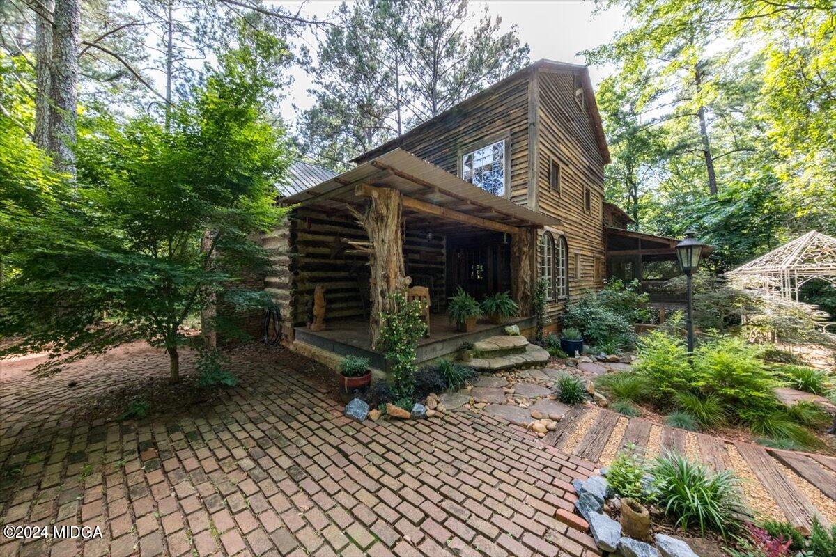 228 Pine Grove Church Road Culloden, GA 31016 - Photo 4 of 40 a front view of a house with garden