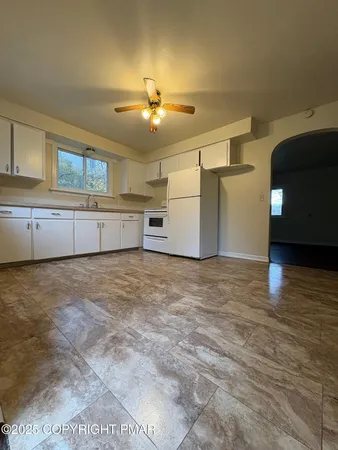 a view of a kitchen with a sink