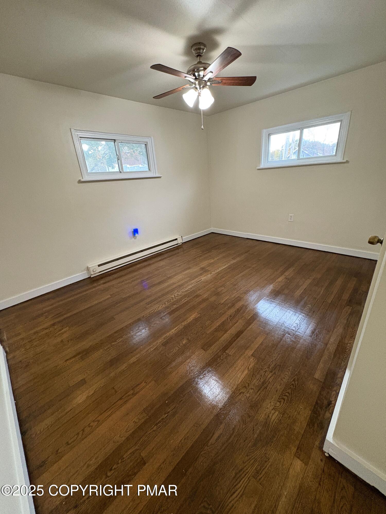 112 Crow Path, Unit 101 Tobyhanna, PA 18466 - Photo 7 of 8 a view of an empty room with a window
