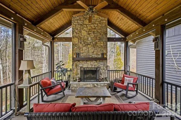 a outdoor living space with furniture and a fireplace