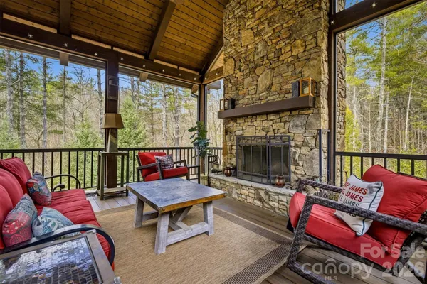 a view of balcony with furniture and wooden floor